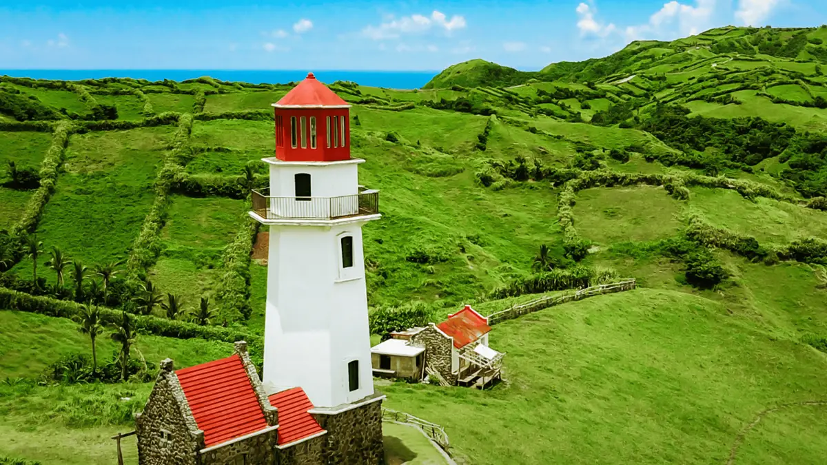 Alapad Rock Formation cut by the coastal road in South Batan, a stop on guided Batanes tours in the Philippines